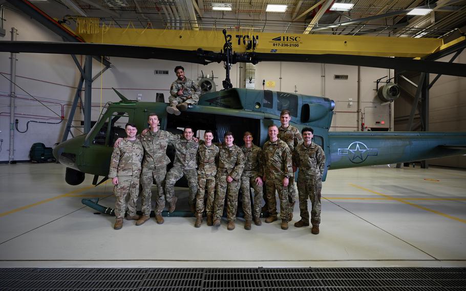 Airmen assigned to the 40th Helicopter Squadron stand for a group photo in front of a UH-1N Huey helicopter following an arrival ceremony for the MH-139A Grey Wolf March 9, 2024, at Malmstrom Air Force Base, Mont. The Huey, a Vietnam-era aircraft, has served Malmstrom AFB for five decades and will be phased out by the Grey Wolf within the next 10 years. 