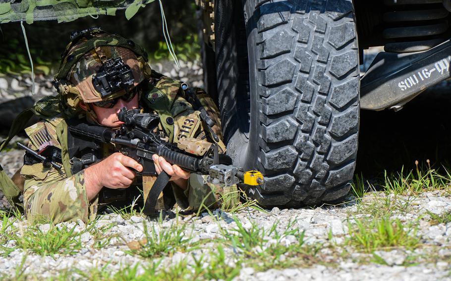 A Security Force Assistance Brigade soldier — known as an advisor — reacts to an enemy attack during a pre-deployment training exercise on Aug. 23, 2023, at Muscatatuck Training Center in Indiana.