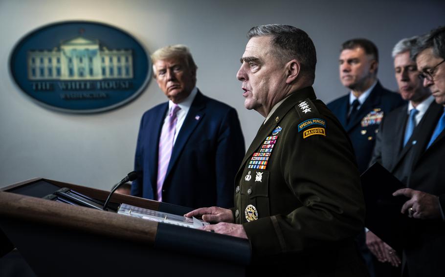 President Donald Trump listens as Gen. Mark A. Milley, chairman of the Joint Chiefs of Staff, addresses the White House press corps in April 2020. 