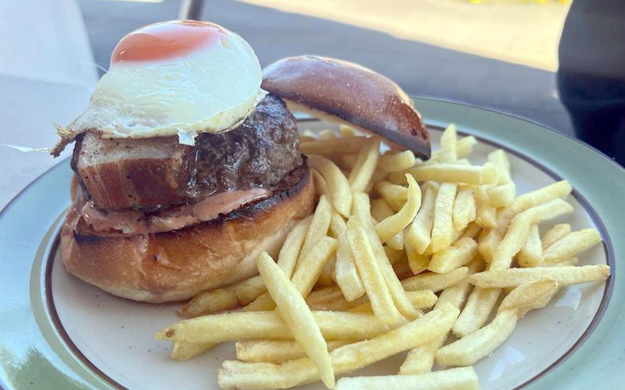 The Smoky Bacon and Egg Burger with a side of fries from Demode Diner, an American-style eatery near Yokota Air Base, Japan.