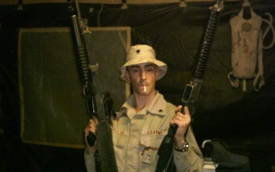 U.S. soldier Lincoln Crisler mugs for the camera while deployed to Iraq in 2004.
