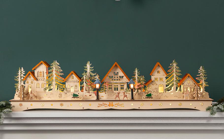 Balsam Hill’s Christmas Mantel Village is crafted of plywood and hand painted. With built-in lights, it’s a charming Victorian-era decoration for mantels, windows or tabletops.