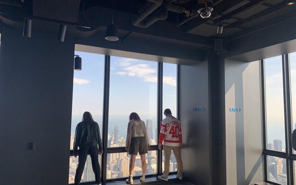 From left, the author, Alyssa Edes and Vasilios Niphoratos re-create the iconic shot from the top of the Sears Tower, now the Willis Tower. MUST CREDIT: Courtesy of Leigh Giangreco.