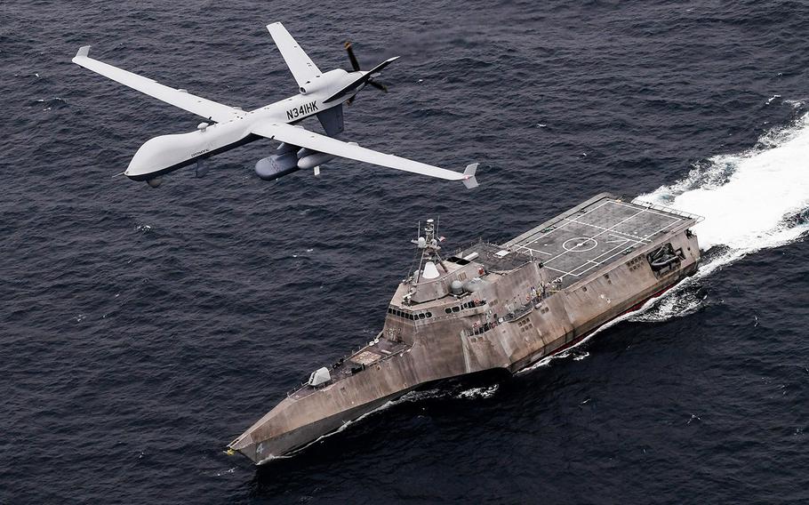 An MQ-9 Sea Guardian unmanned maritime surveillance aircraft system flies over Independence-variant littoral combat ship USS Coronado during U.S. Pacific Fleet’s Unmanned Systems Integrated Battle Problem 21 on April 21, 2021.