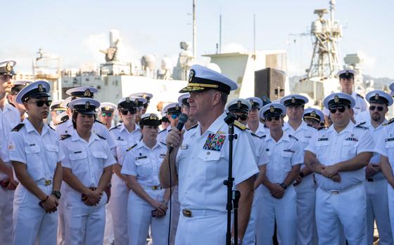 Adm. Samuel Paparo, center, commander, U.S. Pacific Fleet, speaks to Royal Canadian service members about the strength and solidary of Canada and the United States and the importance of cooperation for an enduring, free and open Indo-Pacific region while on the fantail of Halifax-class frigate HMCS Ottawa (FFH 341) during a port visit at Joint Base Pearl Harbor-Hickam, Dec. 9, 2023. (U.S. Navy Photo by Mass Communication Specialist 2nd Class Christopher Sypert)