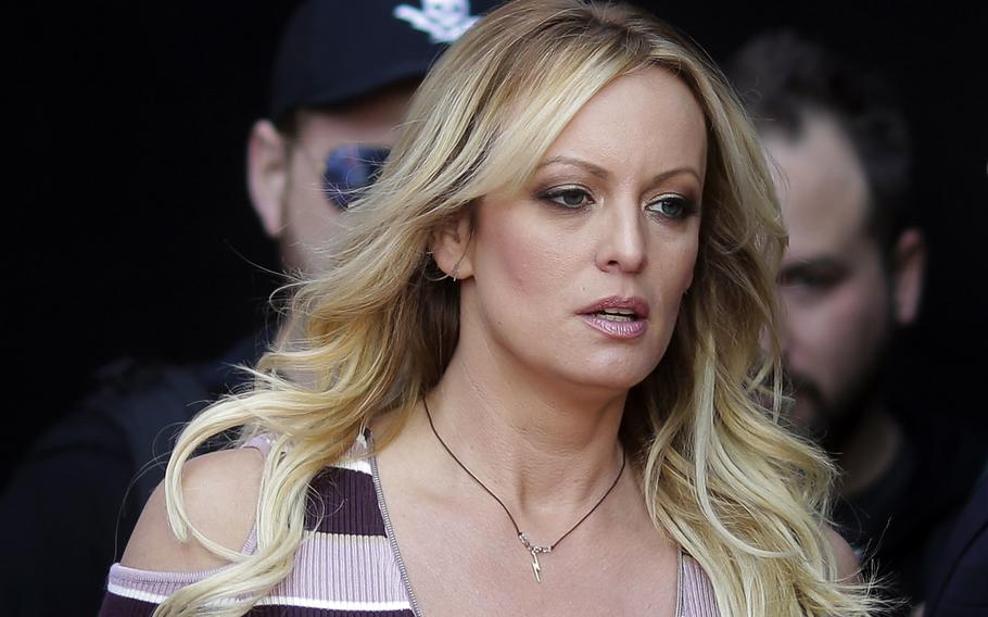 Adult film actress Stormy Daniels arrives for the opening of the adult entertainment fair Venus in Berlin, on Oct. 11, 2018. Daniels’ lawyer said she met Wednesday, March 15, 2023, with prosecutors who are investigating hush money paid to her on behalf of former President Donald Trump.