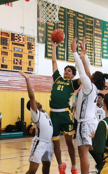 Robert D. Edgren's Josh Simmons tries to score while Zama's Rhino Aumua plays defense.