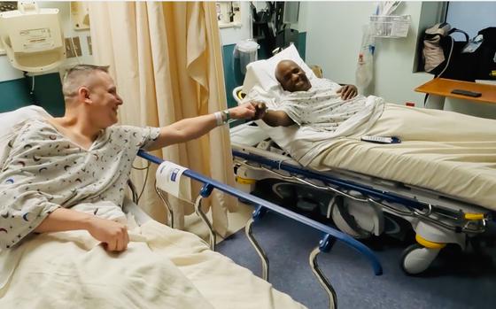Russ Redhead, left, gives James Harris Jr. a fist bump before kidney transplant surgery at the University of Maryland Medical Center in February. 