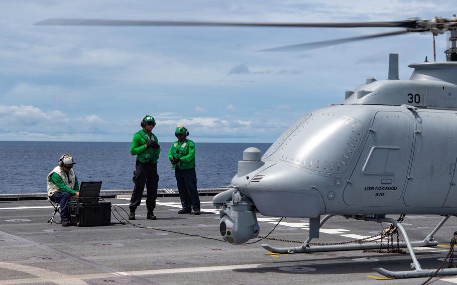 Sailors perform ground turns on an MQ-8C Fire Scout unmanned helicopter aboard the littoral combat ship USS Jackson in the South China Sea, April 29, 2022.