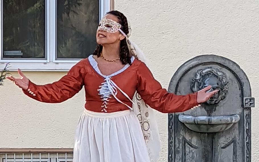 Emily Lamb, a performer at KMC Onstage, acts in a scene of “Medea,” outside at Kleber Kaserne, Kaiserslautern, Germany, Feb. 14, 2022. The theater troupe performed outdoors after sprinklers doused equipment and the stage.