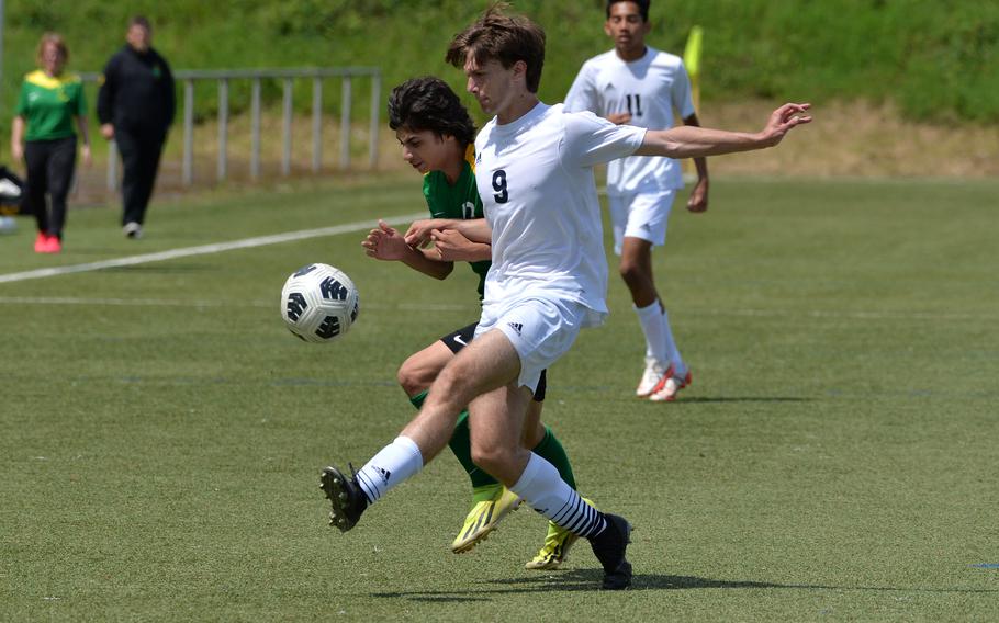 Ansbach’s Alexander Pohlman, right, clears the ball in front of Alconbury’s Dominic Hash in a Division III semifinal at the DODEA-Europe soccer finals in Landstuhl, Germany, May 22, 2024.