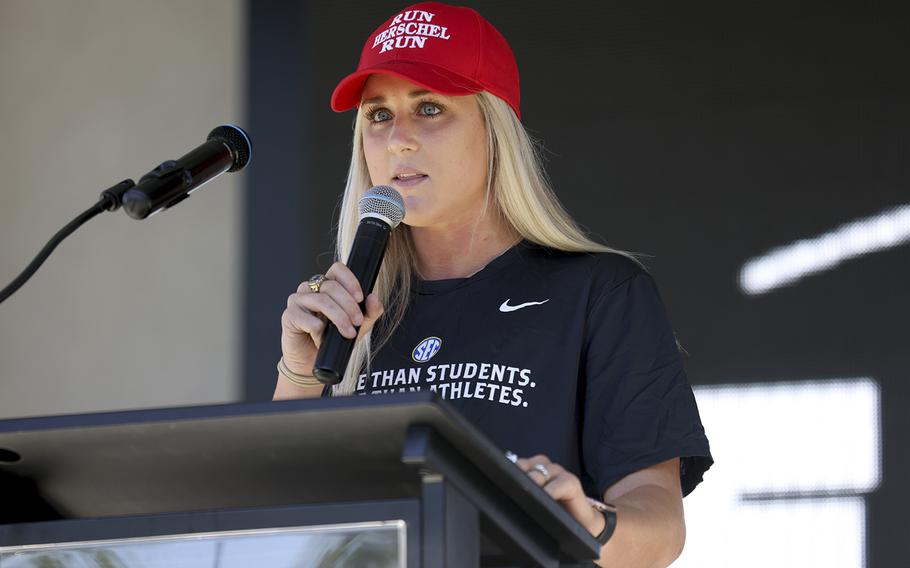 Former University of Kentucky swimmer Riley Gaines speaks during a campaign stop in Canton for Republican U.S. Senate candidate Herschel Walker. She opposes policies that allow transgender athletes to compete in sports that don’t match their gender at birth. 