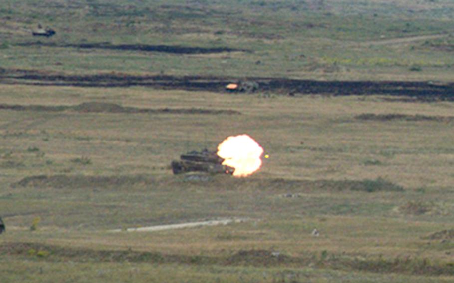 A Hungarian Leopard 2A7 main battle tank fires a round during a coordinated fire support mission.