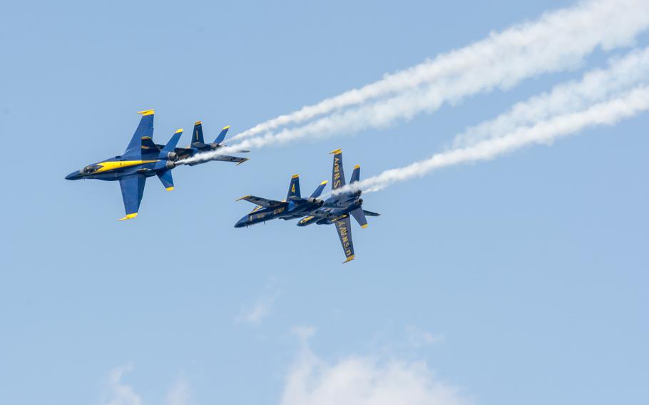 The U.S. Navy flight demonstration squadron, the Blue Angels, perform the Barrel Roll Break maneuver during the National Cherry Festival in Traverse City, Mich., July 1, 2018.