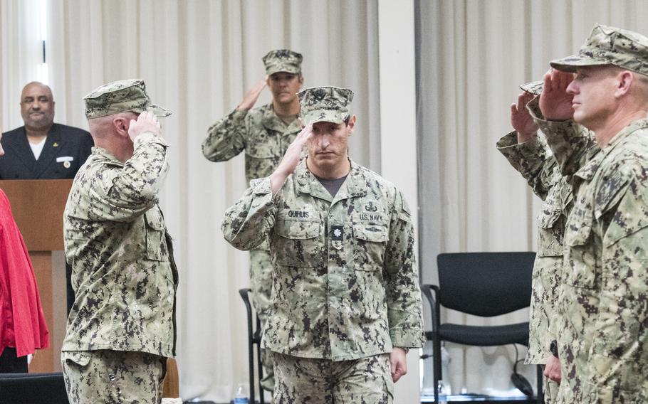 Cmdr. Nicholas Quihuis, commanding officer of Explosive Ordnance Disposal Mobil Unit Two, salutes after a change of command ceremony at Virginia Beach, Va., in November 2022.