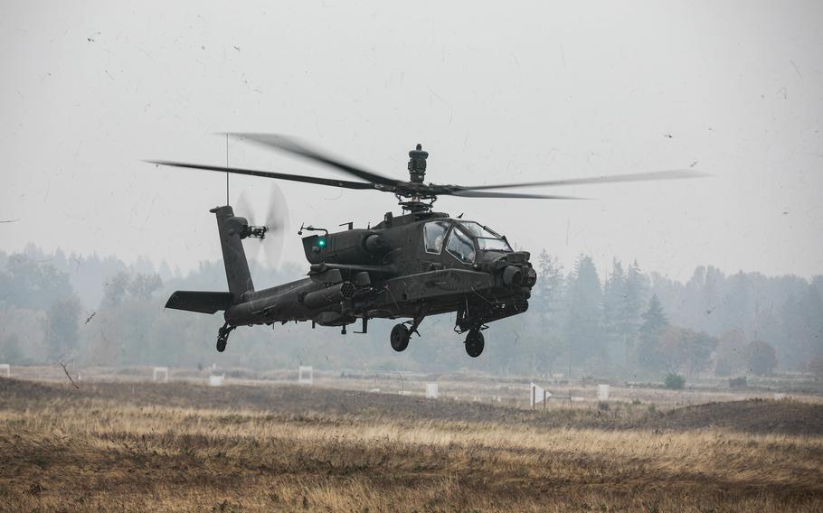 Soldiers assigned to 1-229 Attack Battalion, 16th Combat Aviation Brigade refuel, rearm, and repair AH-64E Apache attack helicopters and other vehicles in October 2022 at the forward arming and refueling point on Joint Base Lewis-McChord, Wash.