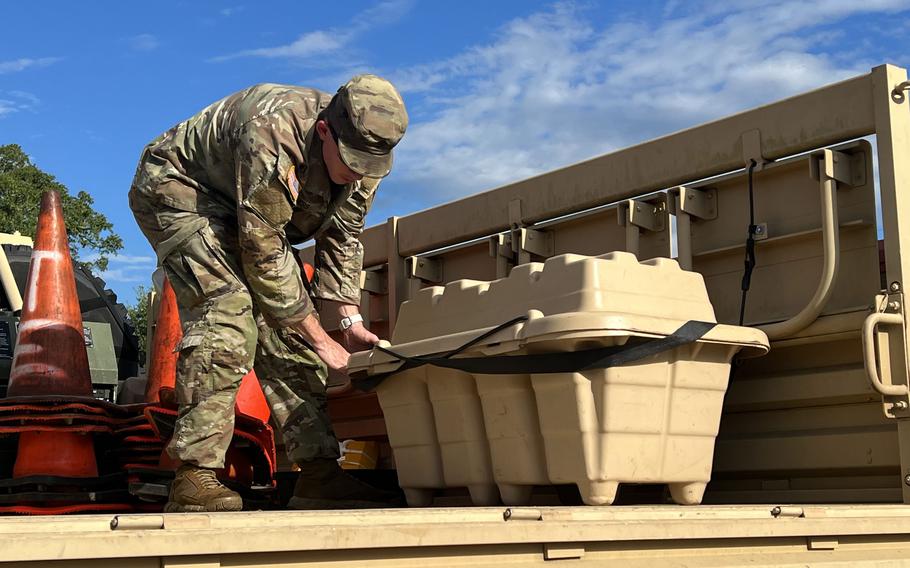 Spc. Jacob Ayers, a Florida National Guard soldier from the 153rd Cavalry Regiment, equips a vehicle to support the relief effort in the wake of Hurricane Idalia at Henry W. McMillan Armory, Tallahassee, Fla., on, Aug. 29, 2023.