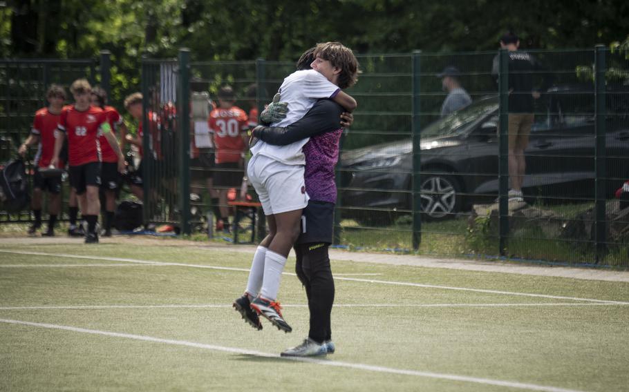 Bahrain Falcons junior goalkeeper Carson Cicchi hugs one of his teammates after a well-fought win against the Marymount Royals during the Division II DODEA European Championships at Reichenbach-Steegen, Germany on May 20, 2025.