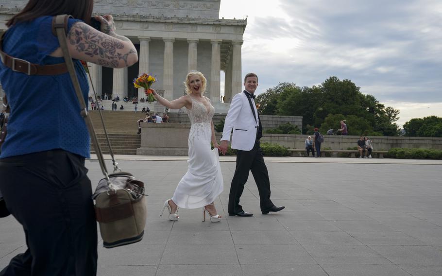 Karen Karas De Waal celebrates her marriage to Christaan De Waal during a photo session with Georgette Tsongos at the Lincoln Memorial on May 18, 2022 in Washington, D.C. 