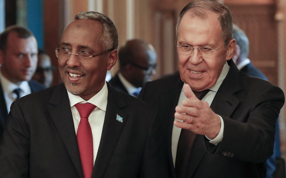 Russian Foreign Minister Sergey Lavrov, right, welcomes Somalia’s Foreign Minister Abshir Omar Huruse for talks in Moscow, Russia, Friday, May 26, 2023. 
