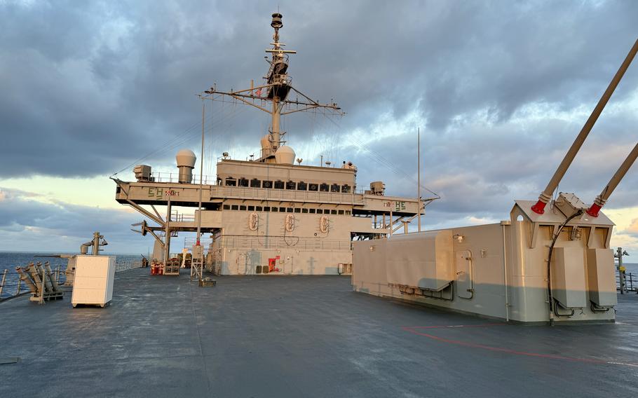The bridge of the US 6th Fleet flagship in front of a cannon.