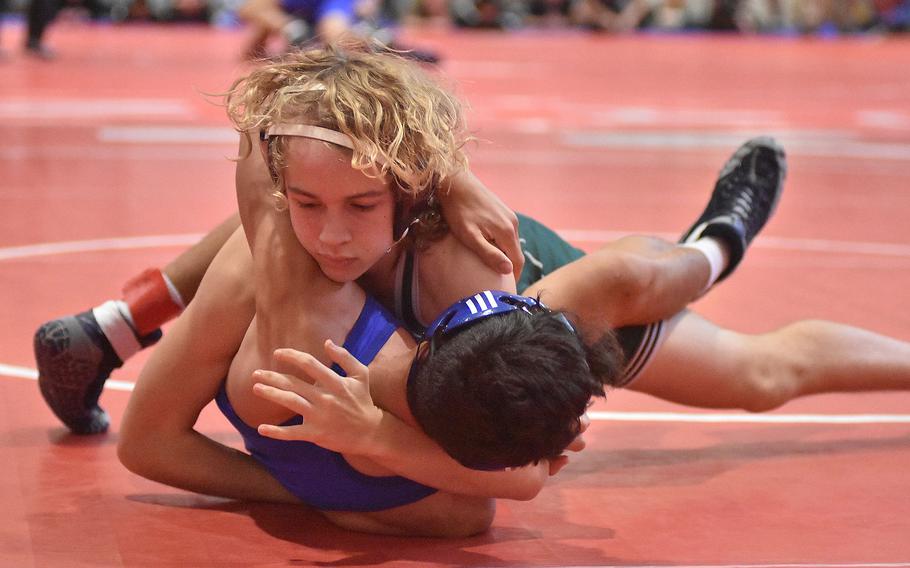 Naples' Liam Hicks pushes Rota's Anthony Romero to his back in a 126-pound match Saturday, Feb. 4, 2023, at the DODEA-Europe Southern Europe regional at Aviano Air Base, Italy.