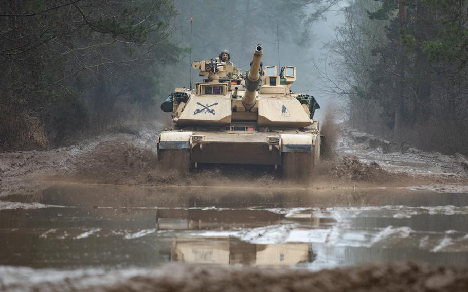 U.S. soldiers operate an M1A2 Abrams tank during an exercise in Bemowo Piskie, Poland, on Feb. 16, 2023.