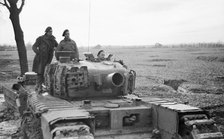 A black and white photo of a tank equipped with a large mortar