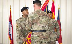 Colonel Eric A. McCoy accepts the colors from  MG Darren L. Werner, commanding general of the U.S. Army Tank-automotive and Armaments Command, during the Change of Command ceremony on July 29, 2021 at Anniston Army Depot.  