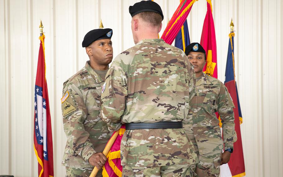 Colonel Eric A. McCoy accepts the colors from  MG Darren L. Werner, commanding general of the U.S. Army Tank-automotive and Armaments Command, during the Change of Command ceremony on July 29, 2021 at Anniston Army Depot.  