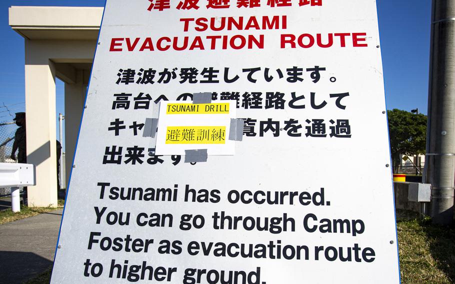A sign provides information to U.S. service members and local community residents as they participate in a tsunami evacuation drill at Camp Foster, Okinawa, Nov. 3, 2021. 