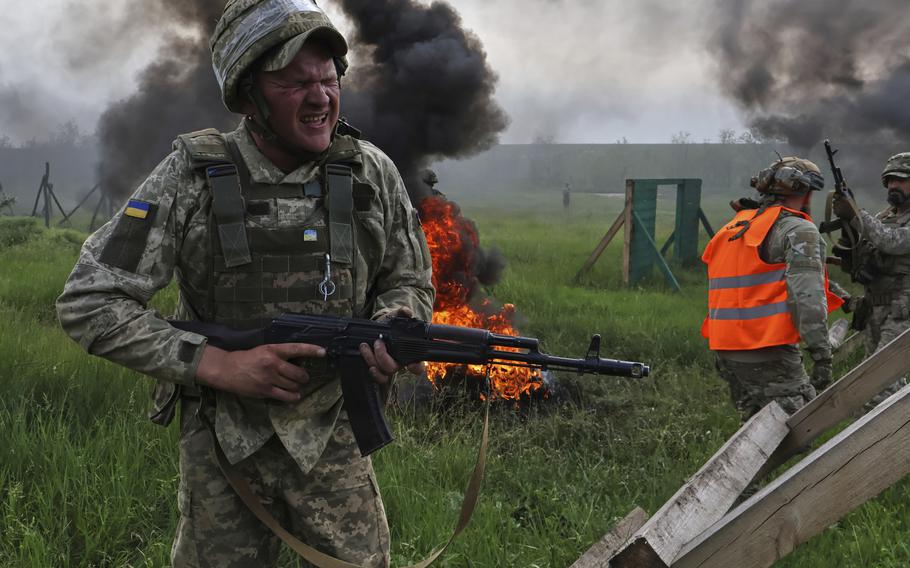 Ukrainian servicemen attend a military training