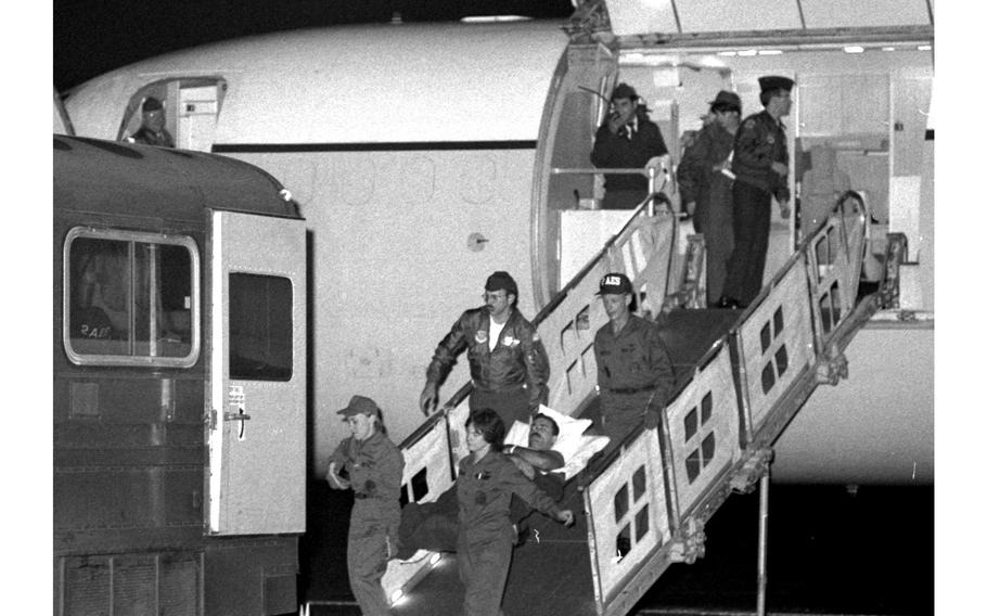 U.S. Marines wounded in the Oct. 23, 1983, bombing of the barracks in Beirut, Lebanon, arrive at Rhein-Main Air Base, Germany, to be transported to the Landstuhl hospital by an ambulance bus.