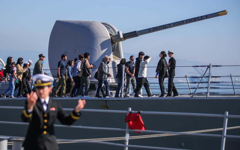 Visitors tour the USS Fitzgerald, as US Navy Lt. Valerie Korioth, left, leads a tour of the USS Princeton during Fleet Week in San Francisco, Calif., on Saturday, Oct. 8, 2022. 