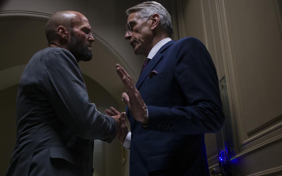 Jason Statham, left, and Jeremy Irons star in “The Beekeeper.”