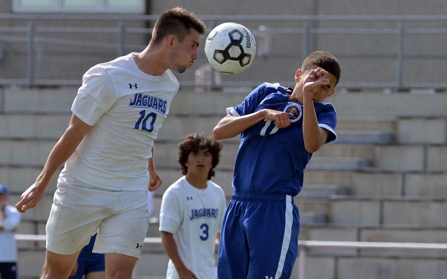 Sigonella’s Jeremy Reardon wins a header against Brussels’ Isaiah Rivera in the boys Division III final at the DODEA-Europe soccer championships in Kaiserslautern, Germany, Thursday, May 19, 2022. Reardon scored two goals in the Jaguars’ 5-0 win.