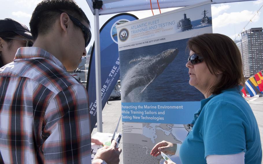 Laura Busch, right, a natural resources program manager at U.S. Fleet Forces Command (USFF), discusses the Atlantic Fleet Training and Testing (AFTT) study area with a visitor at the U.S. Navy’s “Stewards of the Sea: Defending Freedom, Protecting the Environment” exhibit aboard the amphibious assault ship USS Kearsarge (LHD 3) during Fleet Week New York in May 2017. 