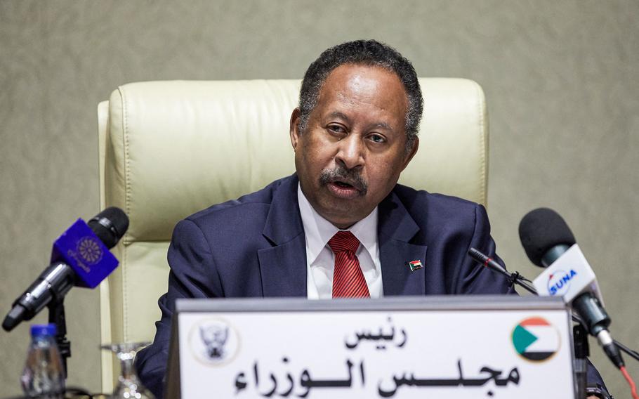 Sudan’s Prime Minister Abdalla Hamdok chairs a Cabinet meeting in the capital Khartoum on Tuesday, Sept. 21, 2021. 