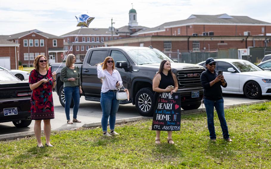 Family members of Marines with the 26th Marine Expeditionary Unit await the arrival of their service members after returning from deployment with the 26th MEU, Camp Lejeune, N.C., Sunday, March 17, 2024.