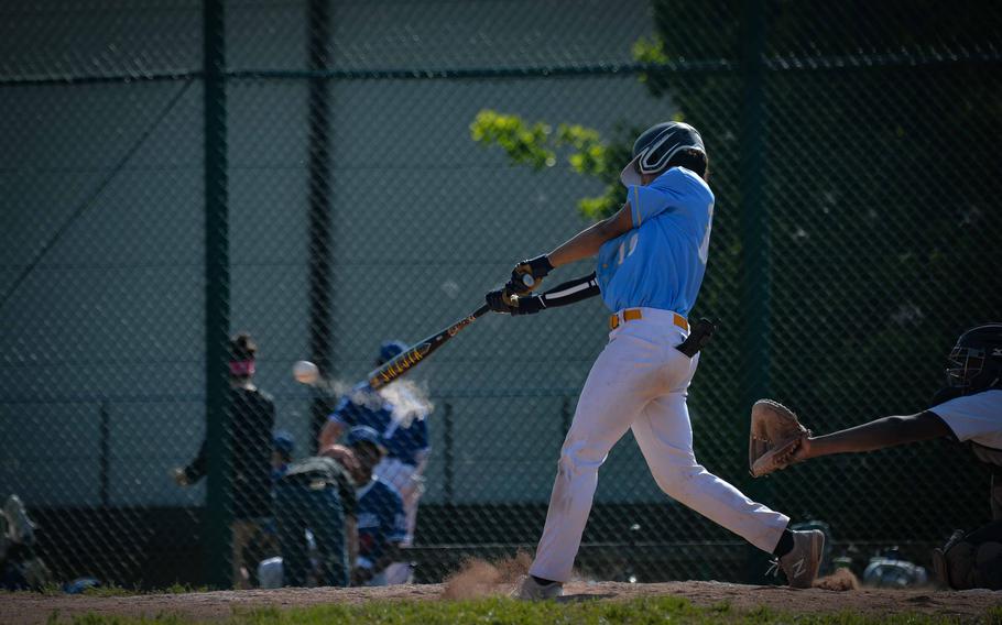 Sigonella freshman Drake Dawson slams a ball  during the DODEA-Europe Division II-III Baseball Championships at Ramstein Air Base, Germany, May 18, 2023.