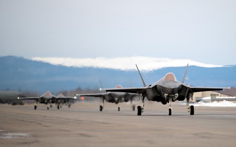 Four F-35A Lightning II fighter jets taxi on the runway at Eielson Air Force Base, Alaska, Oct. 19, 2021.