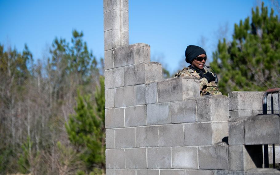 Senior Airman LaKeisha Williams with the 174th Attack Wing, Syracuse, N.Y., coordinates via radio with team members during a PATRIOT 24 search and rescue exercise at Camp Shelby, Miss., Monday, Feb. 19, 2024.
