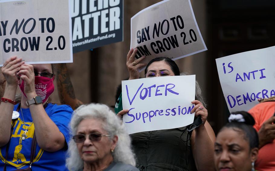 Demonstrators join a rally to protest proposed voting bills on the steps of the Texas Capitol on July 13, 2021, in Austin, Texas.