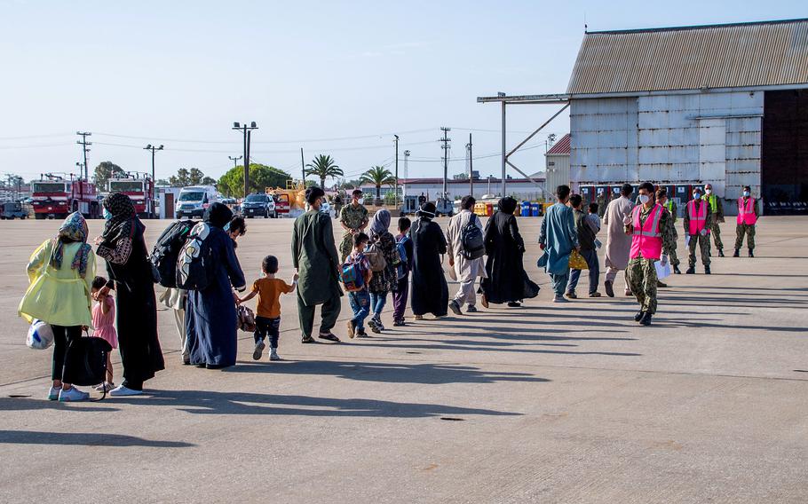 Evacuees from Afghanistan arrive at Naval Station Rota, Spain, on Friday, Aug. 27, 2021. 