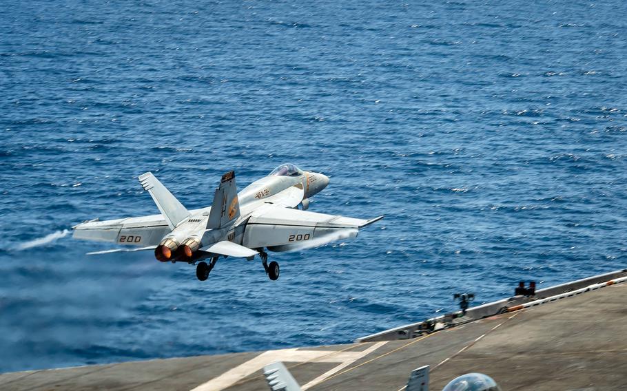 An F/A-18E Super Hornet  launches from the aircraft carrier USS Theodore Roosevelt in the South China Sea, Tuesday, April 6, 2021.
