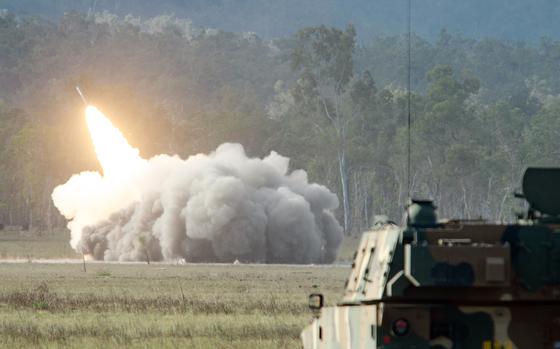 U.S. soldiers fire an M142 High Mobility Artillery Rocket System, or HIMARS, during a Talisman Sabre drill at Shoalwater Bay Training Area in Queensland, Australia, Saturday, July 22, 2023.