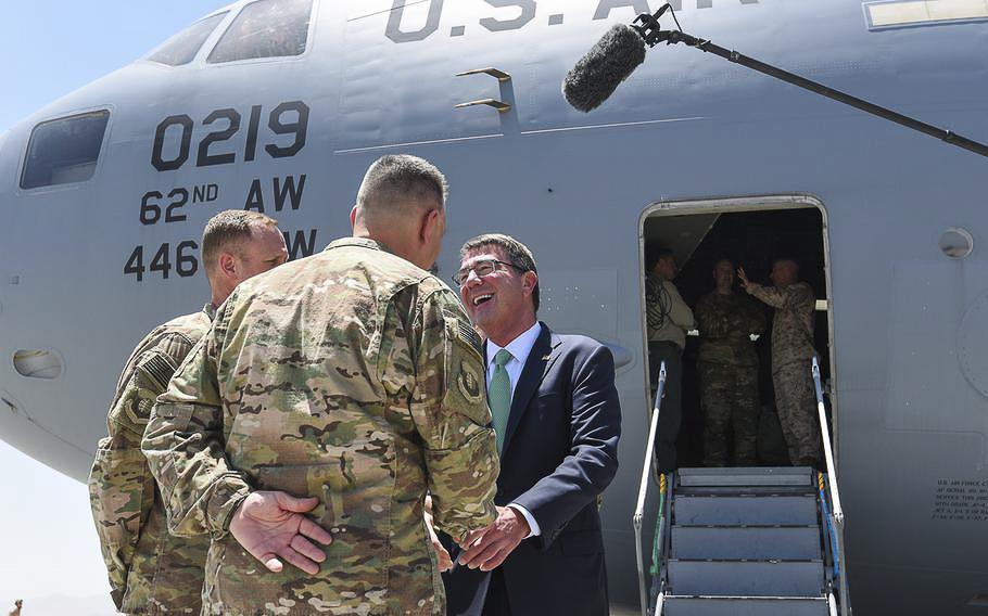 Defense Secretary Ash Carter is greeted by U.S. Air Force officers at Bagram Air Field on Tuesday, July12, 2016. The secretary traveled to Kabul to meet with Afghan leadership and Resolute Support commanders.    
