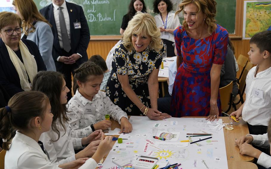First lady Jill Biden and first lady of Romania Carmen Iohannis visit the Școala Gimnaziala Uruguay, or Uruguay School, in Bucharest Romania, Saturday, May 7, 2022. Biden visited several classrooms to visit with children and the educators who are helping teach displaced Ukrainian children.