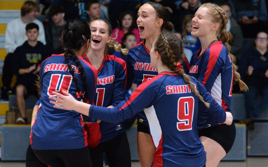 The Aviano Saints celebrate after beating Black Forest Academy 25-19, 25-21, 24-26, 25-23 to capture the Division II DODEA-Europe volleyball crown at Ramstein, Germany, Oct. 28, 2023.