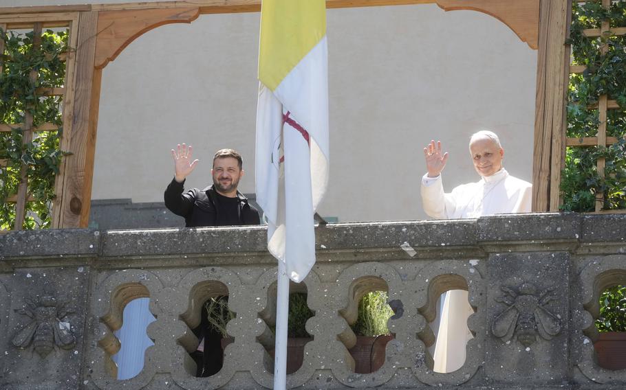 Ukraine President Volodymyr Zelenskyy, left, and Pope Leo XIV wave